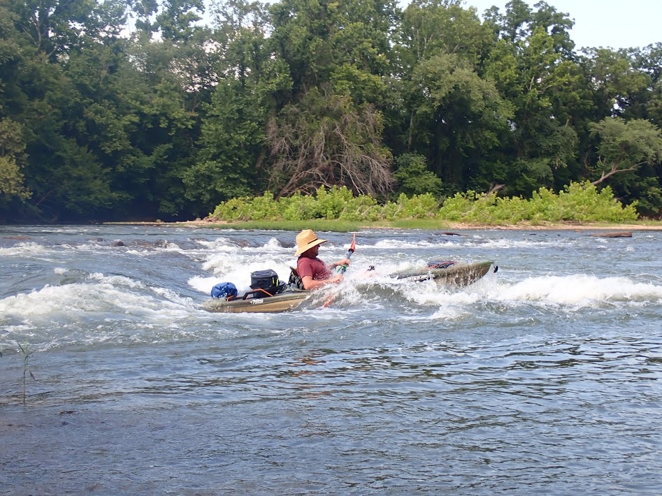 Man kayaking through rapids